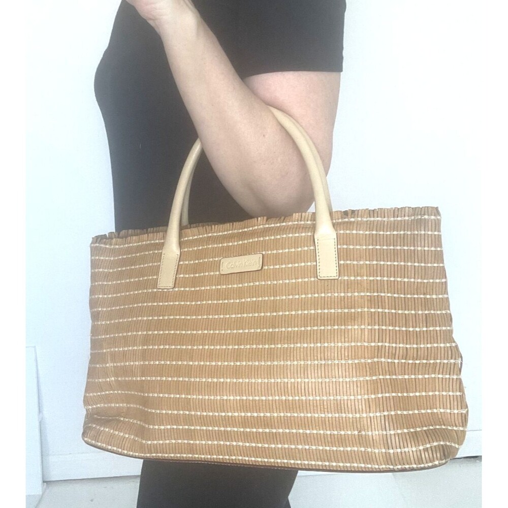 Vintage Calvin Klein Collection LEATHER fringe woven bag. Super cute for summer!